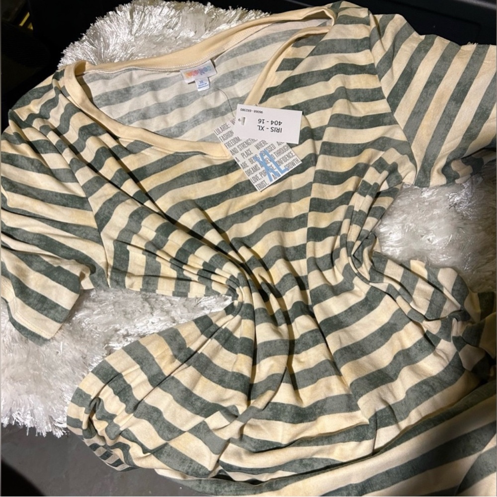 Size XL beautiful LuLaRoe Iris shirt.  Great for work or casual! New with tags.